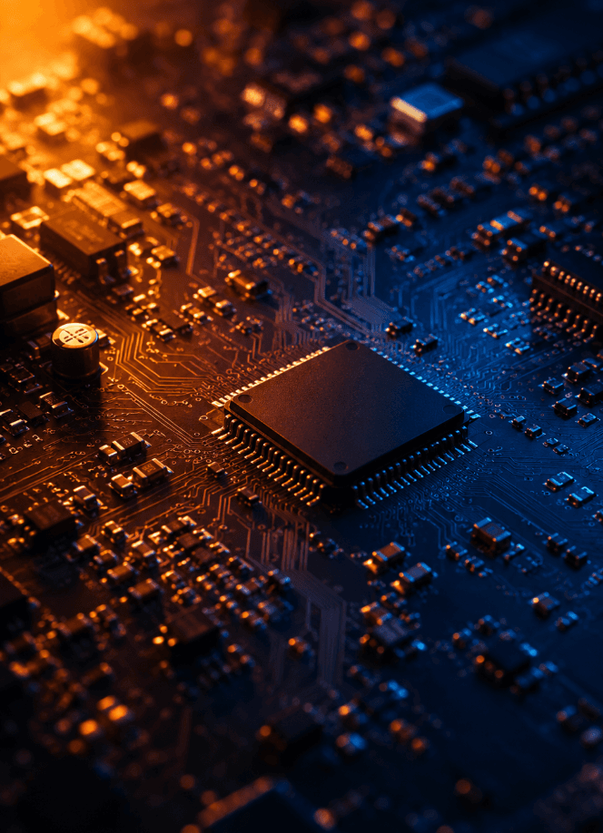 A circuit board lit warm-to-cool around a central processor.